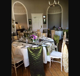 Pinched Taffeta Chair Veils in Olive Green with Flock Tails with Matching Table Runners on Cream Table Linen