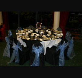 Powder Blue Organza Sashes on Black Chair Covers at Carlisle Racecourse