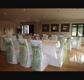 Two Tone Green Sashes on White Chair Covers at Heather Glen