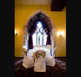 Gold Chair Bands with diamante brooch on White Chair Covers at Langley Castle