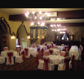 Ruby Red Organza Sashes on White Chair Covers at Langley Castle