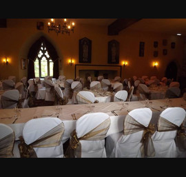 Bronze side tied Sashes on White Chair Covers at Langley Castle