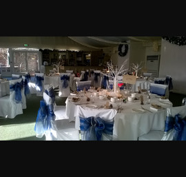 Silver and Blue Organza Double Bows on White Chair Covers