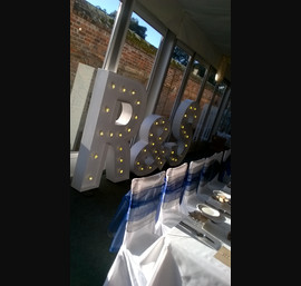 Silver and Blue Organza Double Bows on White Chair Covers