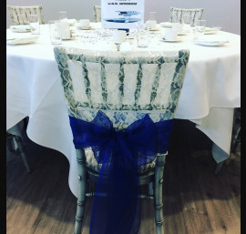 Ivory Lace Chair Hood with Royal Blue Organza Sash on Chiavari Chairs