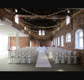 Ivory Chiffon Drapes on Limewash Chiavari Chairs in the Abbey Suite