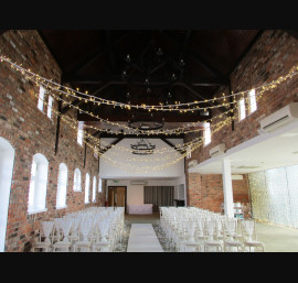 Ivory Chiffon Drapes on Limewash Chiavari Chairs in the Abbey Suite