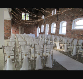 Ivory Chiffon Drapes on Limewash Chiavari Chairs in the Abbey Suite