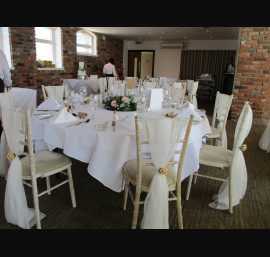 Ivory Chiffon Drapes on Limewash Chiavari Chairs in the Abbey Suite