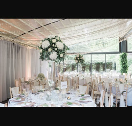 Ivory Chiffon Drapes on Limewash Chiavari Chairs at Delamere Manor