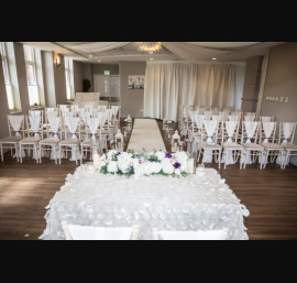 Ivory Chiffon Drapes on Limewash Chiavari Chairs