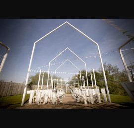 Ivory Ruffle Tail Hoods on Limewash Chiavari Chairs