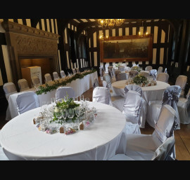 Silver Satin Bows on White Chair Covers in The Banqueting Room