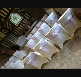 Lavender Organza Sashes on Ivory Chair Covers