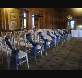 Navy Organza Sashes on Limewash Chiavari Chairs