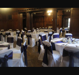 Purple Satin Bows on White Chair Covers