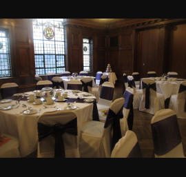 Purple Satin Bows on White Chair Covers