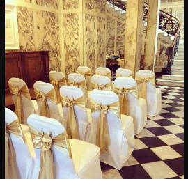 Gold Satin Bows on White Chair Covers