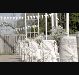 Ivory Ruffle Tail Hoods on Limewash Chiavari Chairs