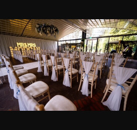 White Chiffon Drapes with Dusty Blue Ribbons at Delamere Manor