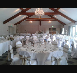 Burlap and lace sashes on white chair covers