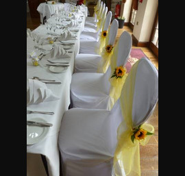 lemon organza sashes with sunflowers top table